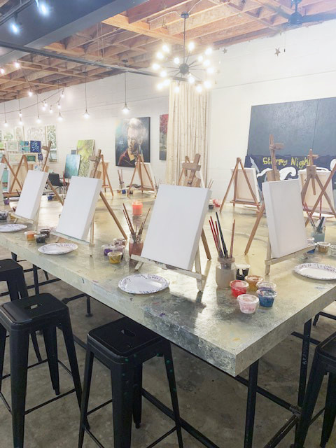Participant tracing an image onto canvas