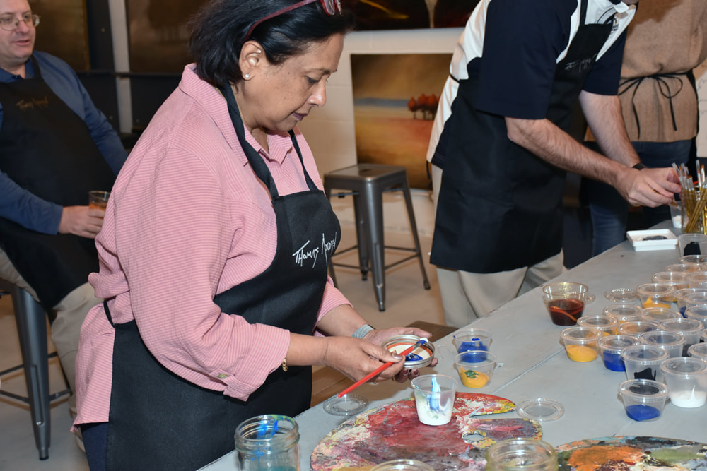 Group canvas painted and signed during a Thomas Andrew Art mural team-building event.