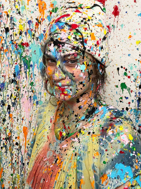 A splattered beanie from the studio's apparel line